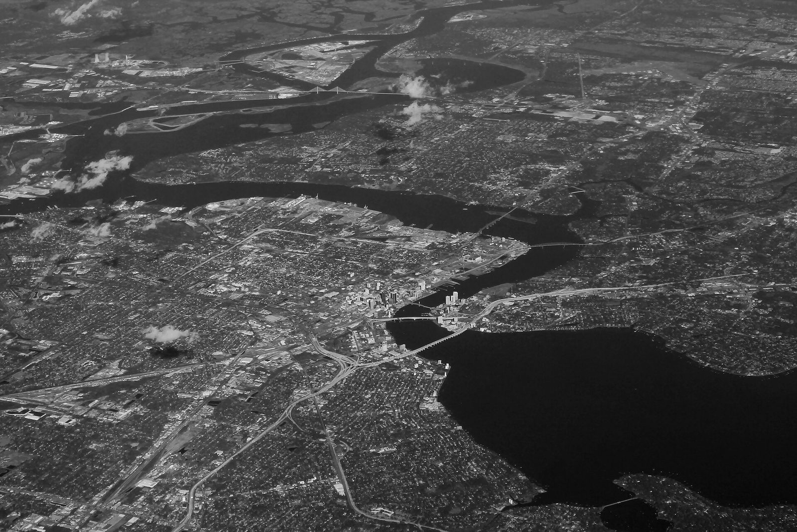 Black and white aerial photo of downtown Jacksonville, Florida, and the winding St. Johns River